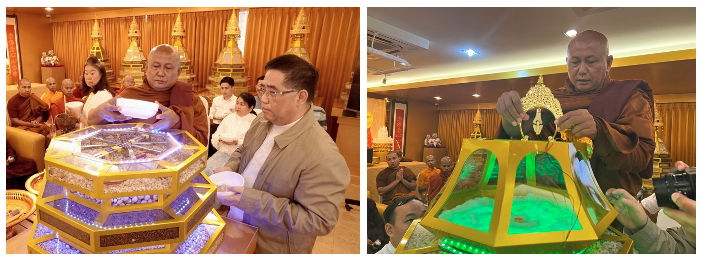 A person standing at a table with a green object in front of him
Description automatically generated